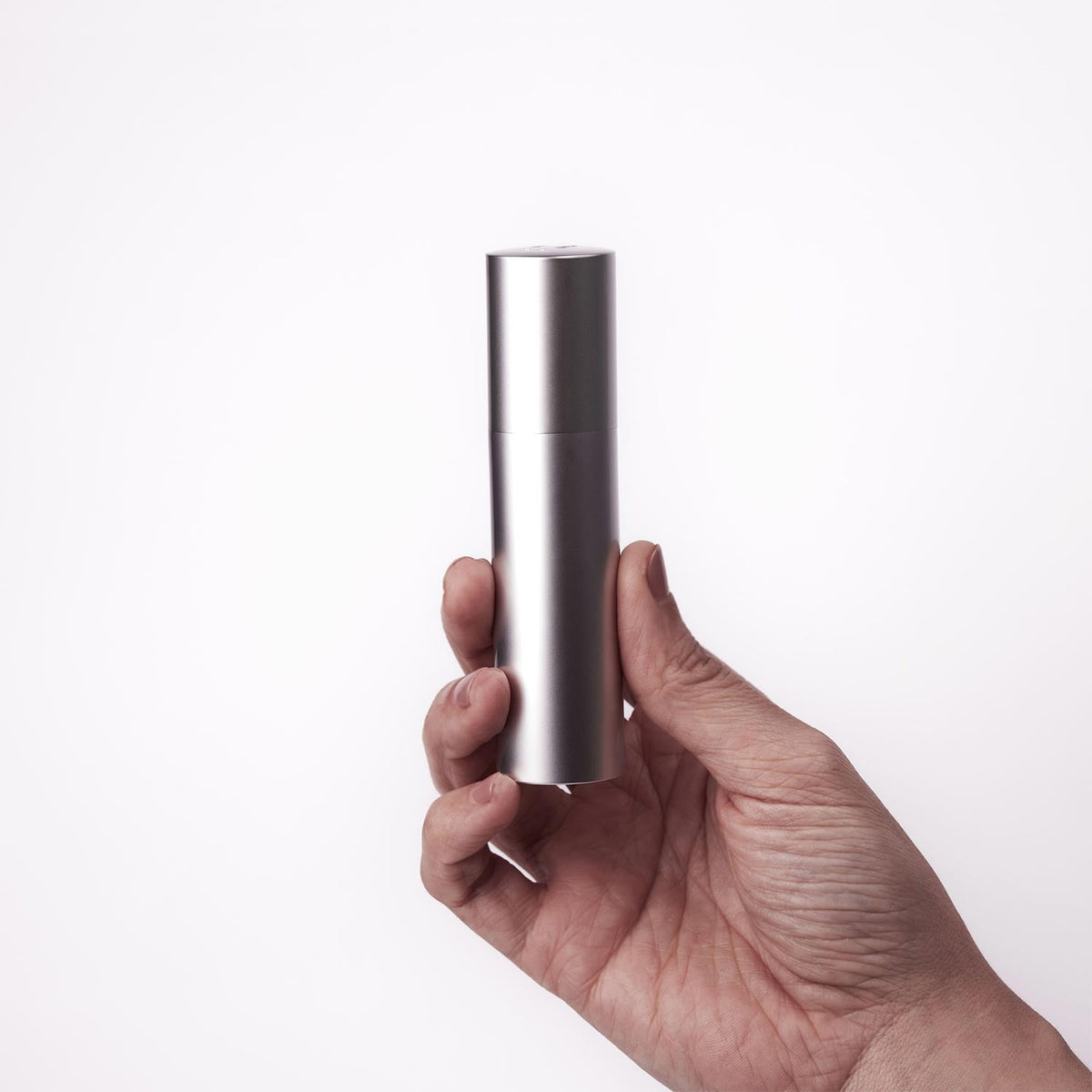 Überlube Good-to-Go case shown in hand for scale